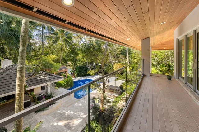 an aerial view of a house with a yard and garden