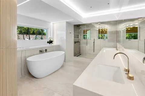 a view of a house with backyard and balcony