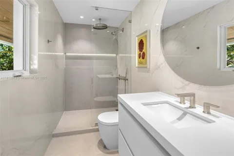 a living room with furniture gym equipment and a large window