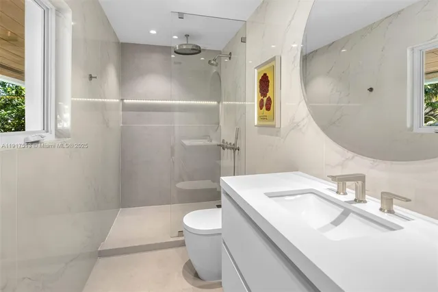 a living room with furniture gym equipment and a large window