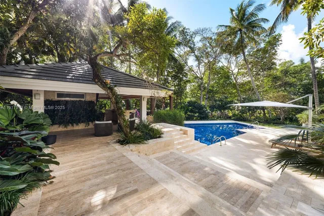 an aerial view of a house with a yard and garden