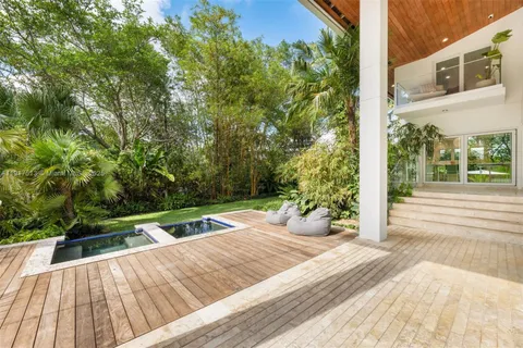 an aerial view of a house with a yard and garden