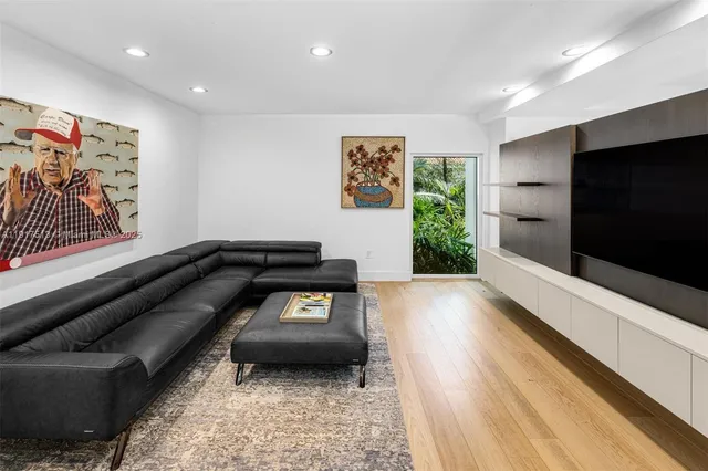 a bedroom with a bed and a large window with outer view