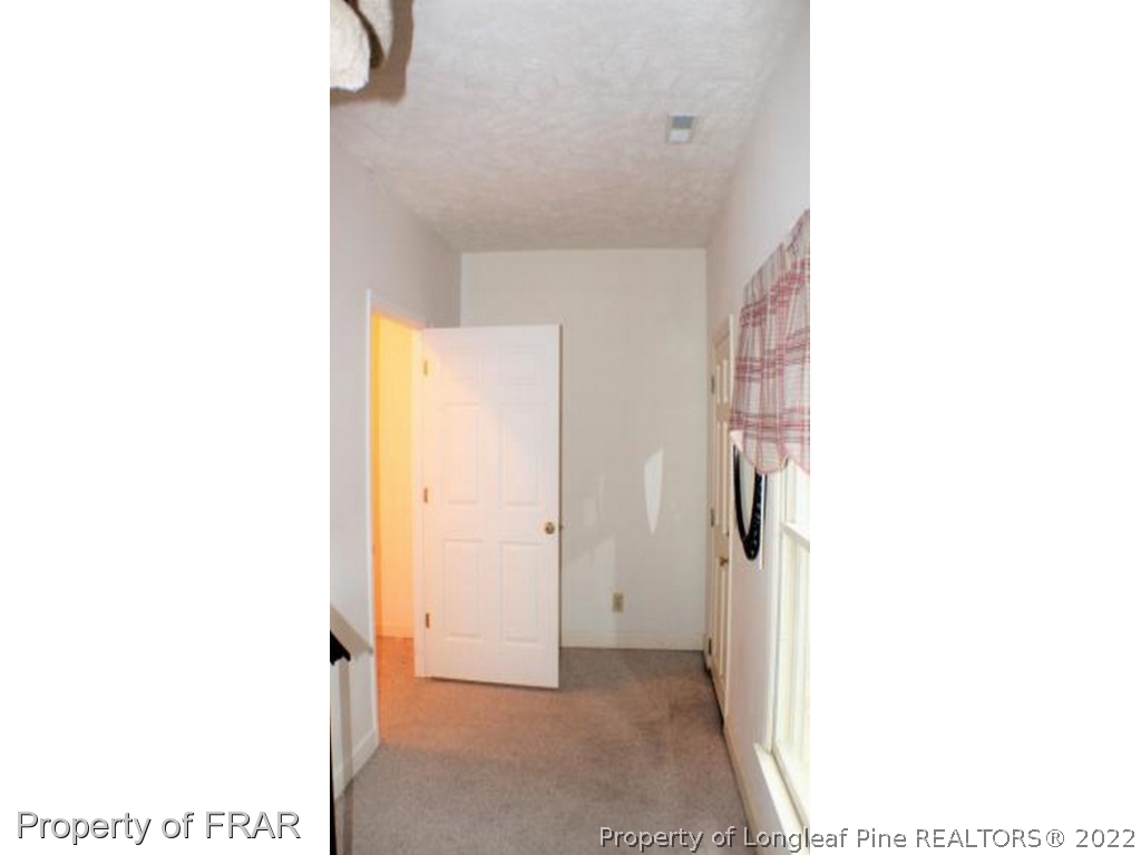 245 Fieldcrest Road Southern Pines, NC 28387 - Photo 17 of 26 a view of a room with a door