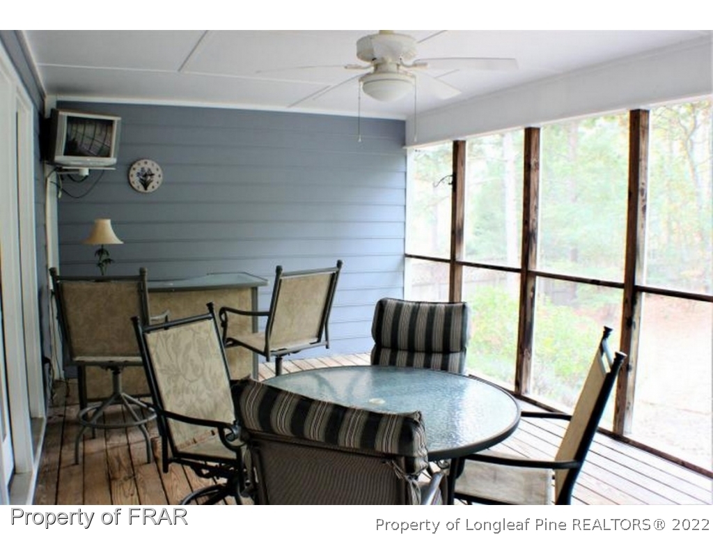 245 Fieldcrest Road Southern Pines, NC 28387 - Photo 18 of 26 a view of a dining room with furniture window and wooden floor