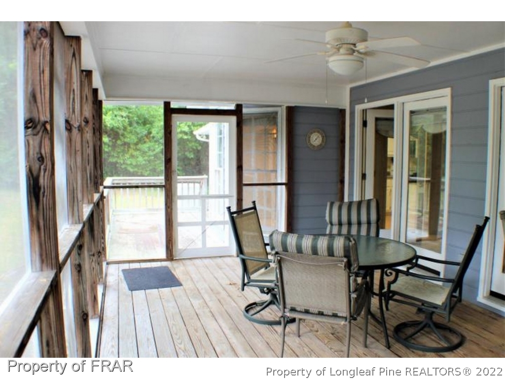 245 Fieldcrest Road Southern Pines, NC 28387 - Photo 19 of 26 a dining room with furniture and wooden floor
