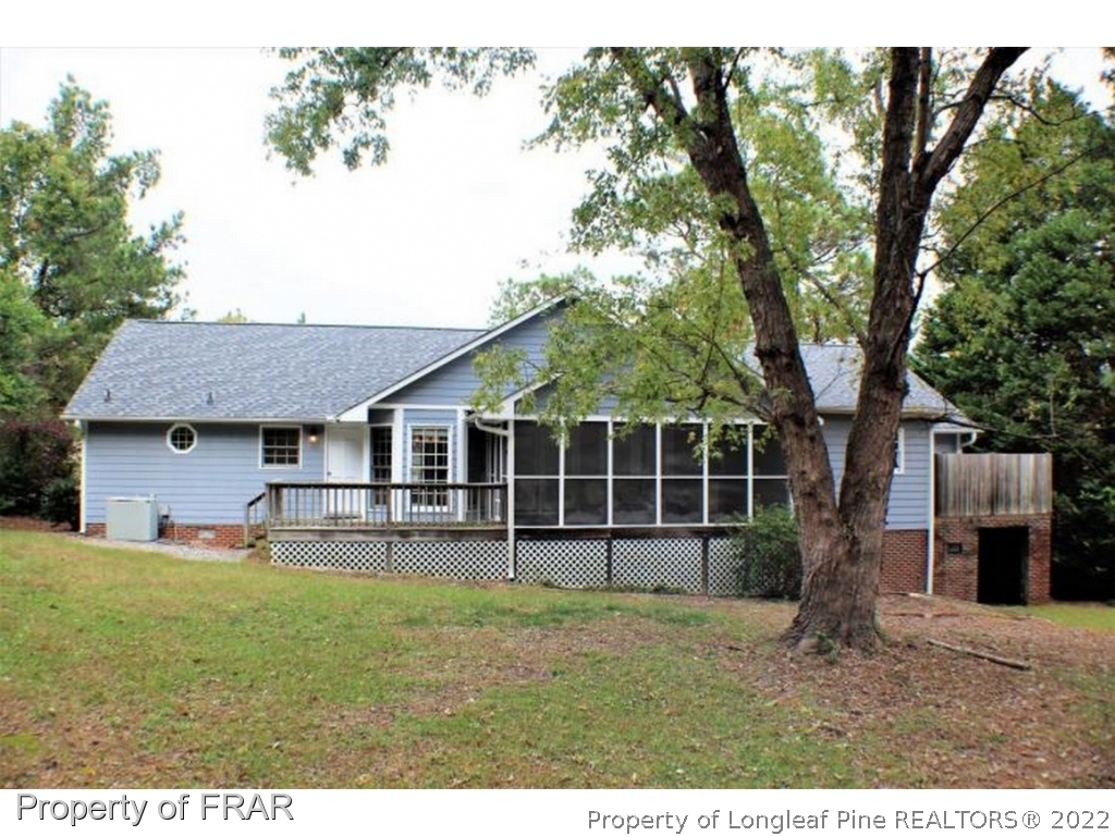 245 Fieldcrest Road Southern Pines, NC 28387 - Photo 21 of 26 a front view of a house with garden