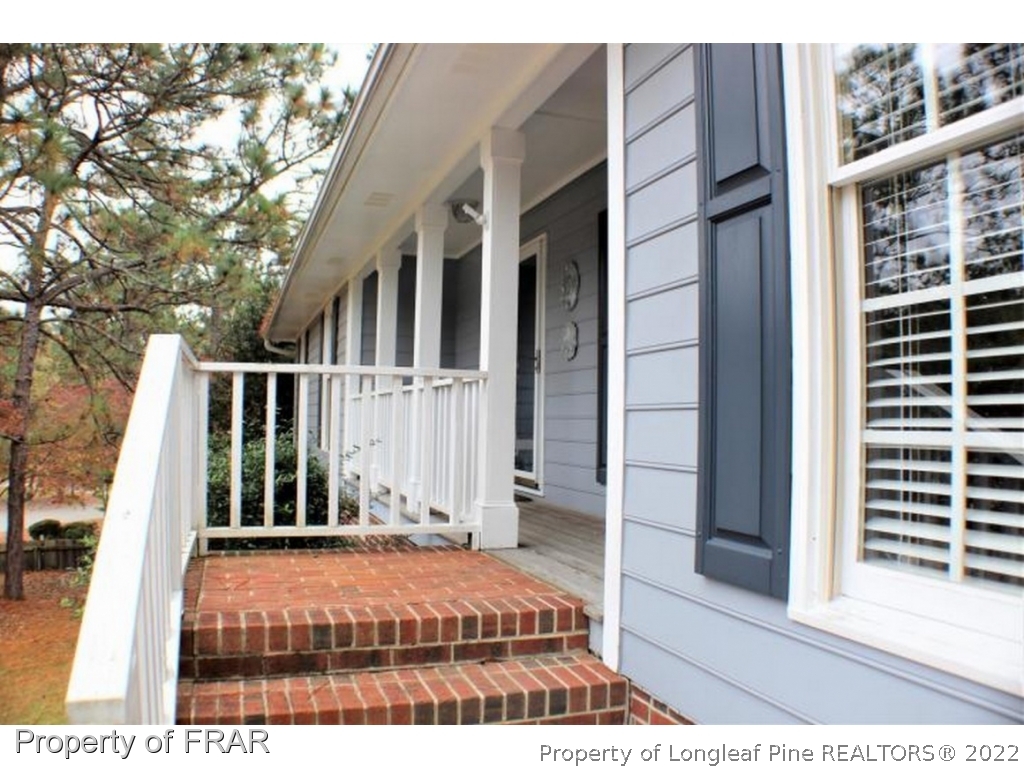 245 Fieldcrest Road Southern Pines, NC 28387 - Photo 25 of 26 a view of a brick house with a large window