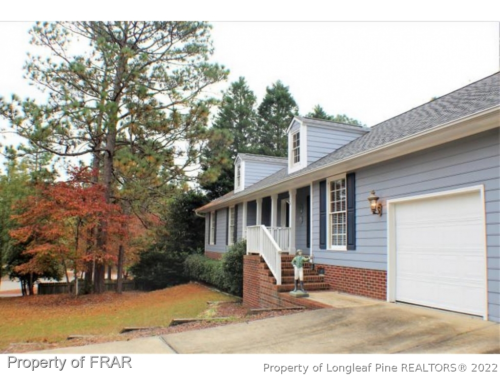 245 Fieldcrest Road Southern Pines, NC 28387 - Photo 26 of 26 a view of a house with a patio
