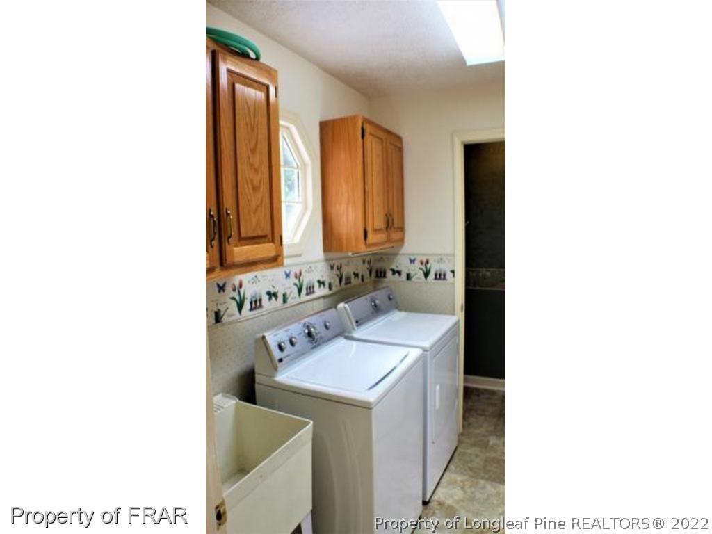 245 Fieldcrest Road Southern Pines, NC 28387 - Photo 8 of 26 a bathroom with a sink and a mirror