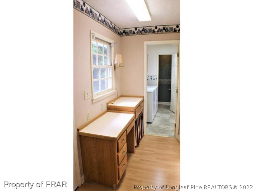 245 Fieldcrest Road Southern Pines, NC 28387 - Photo 9 of 26 a en suite bathroom with a sink and a mirror