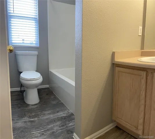 a bathroom with a toilet and a sink