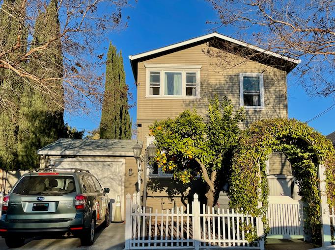 a view of a car park in front of a house
