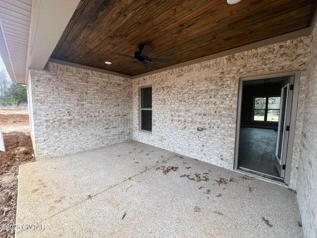 a view of empty room with windows