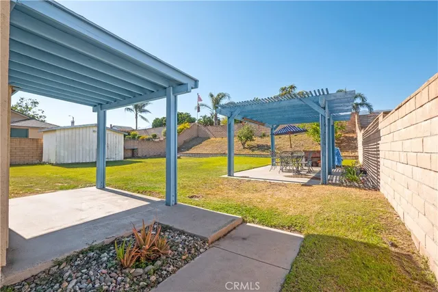 a view of a backyard with swimming pool