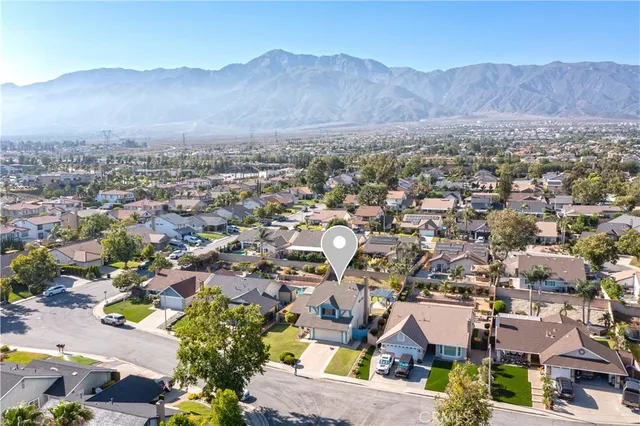 an aerial view of residential houses and trees