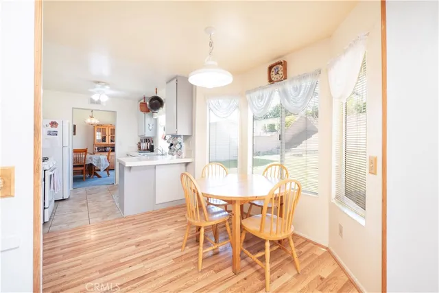 a view of a dining room kitchen and windows
