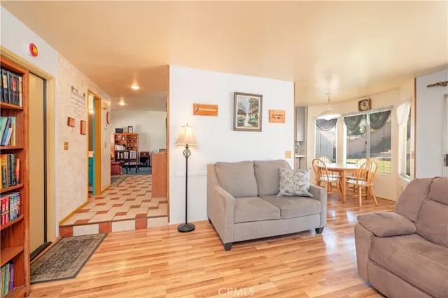 a living room with furniture and a table