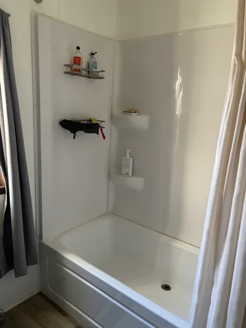 a living room with furniture and flat screen tv