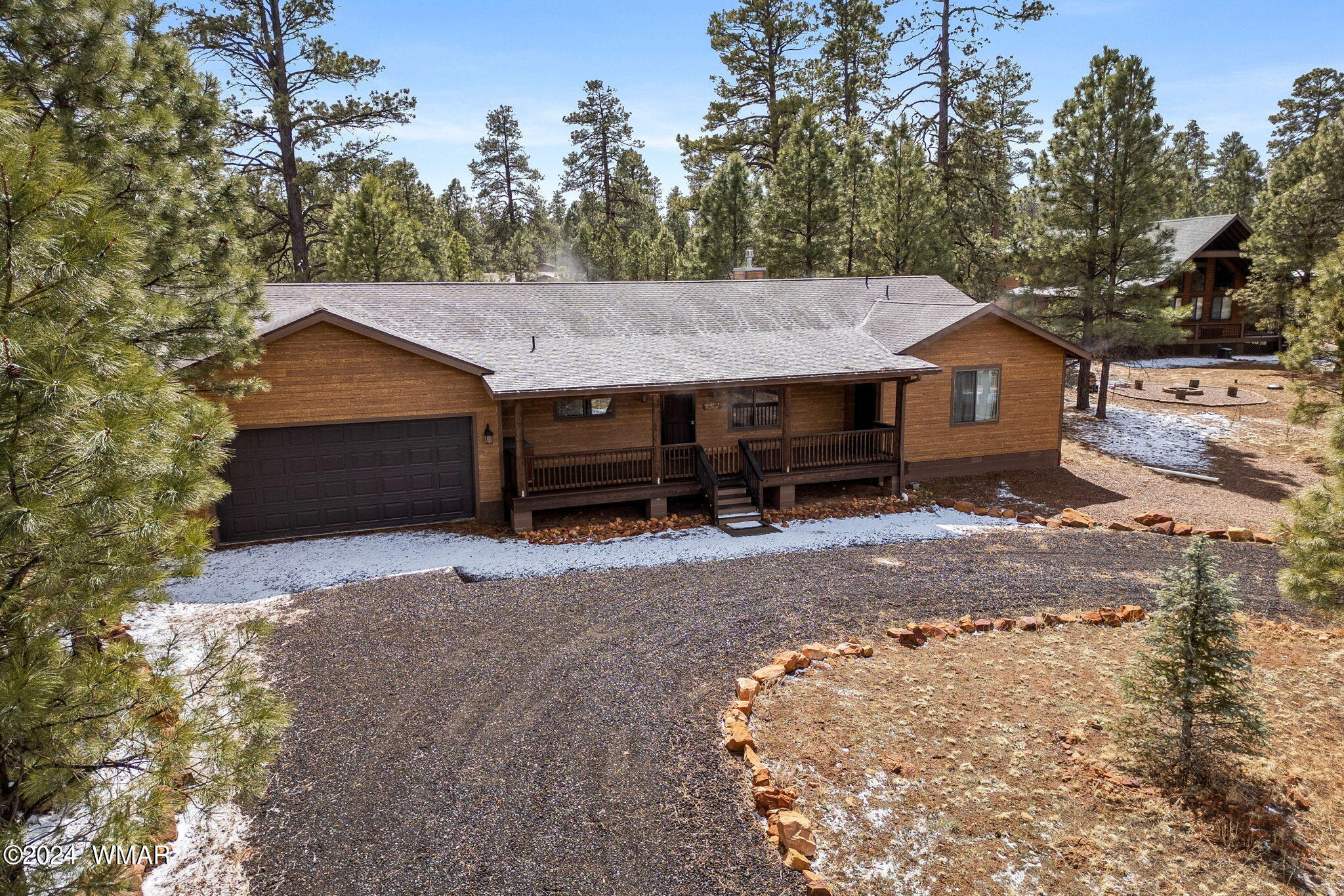 2054 Christmas Pine Road Overgaard, AZ 85933 - Photo 29 of 34 a front view of a house with a yard and trees