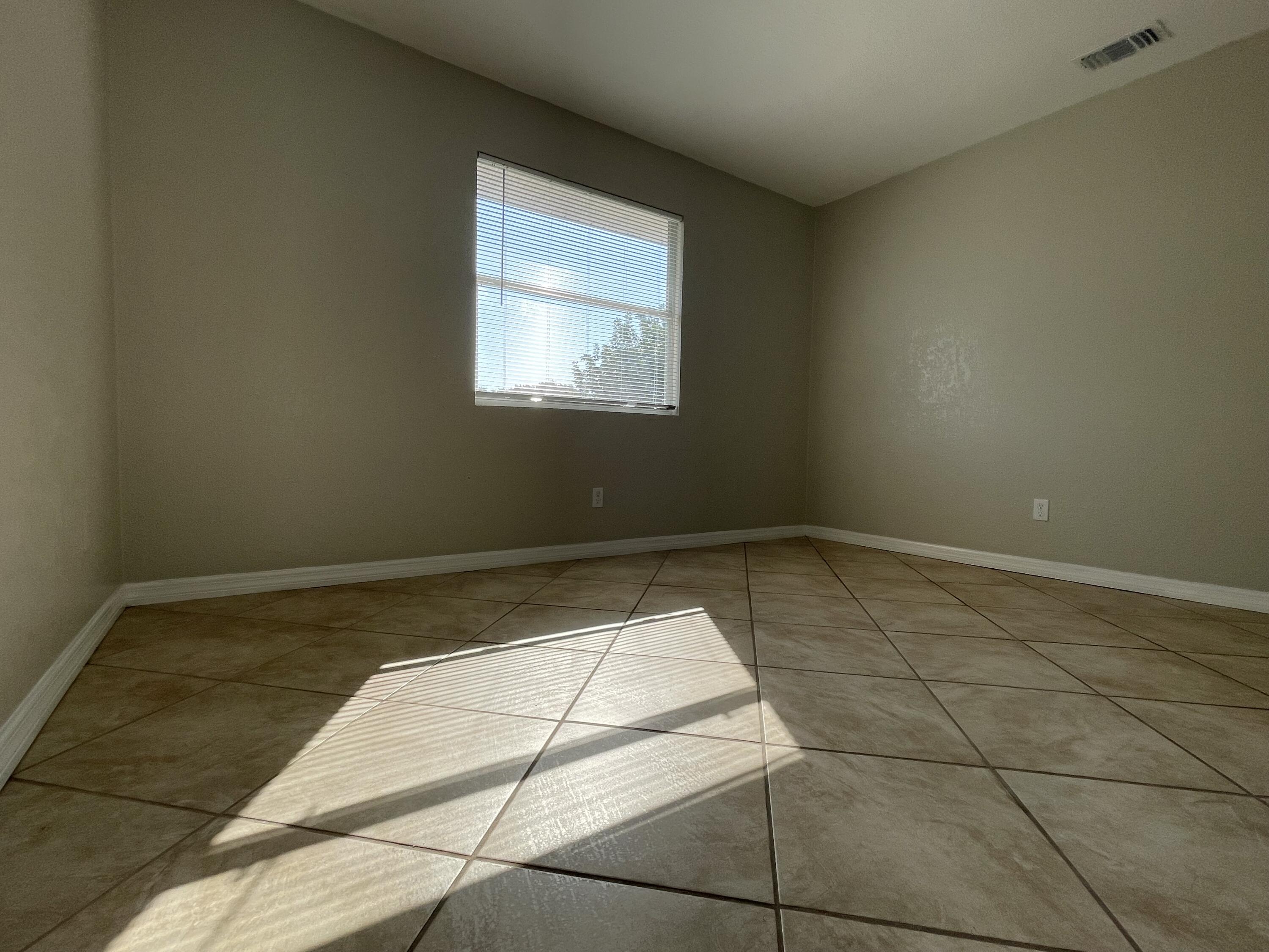 2880 Harson Way Fort Pierce, FL 34946 - Photo 24 of 40 a view of a room with wooden floor and a window