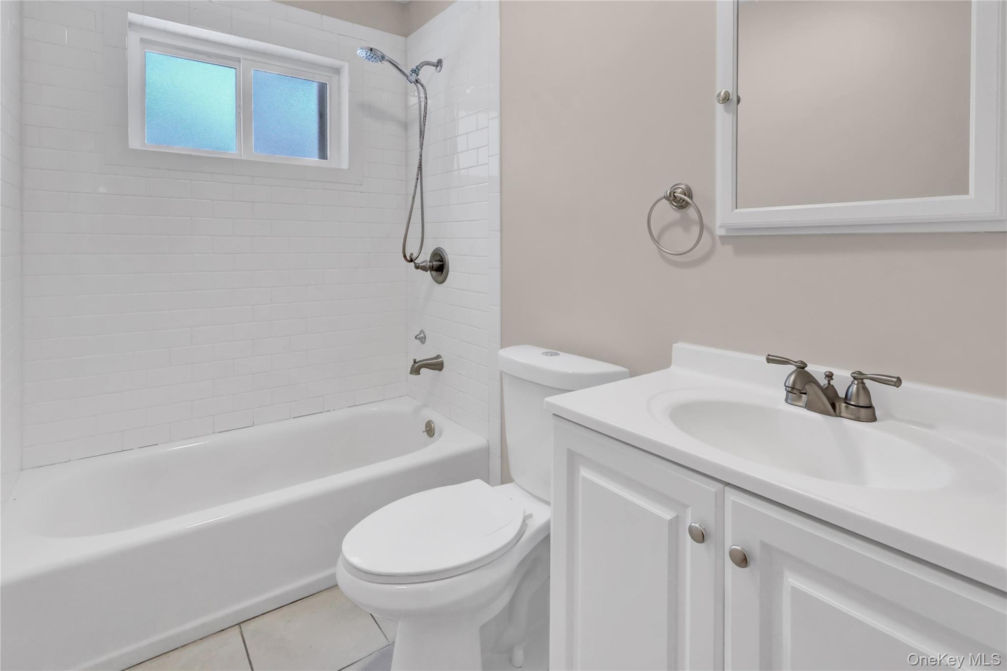 2 7th Street Center Moriches, NY 11934 - Photo 14 of 28 a bathroom with a sink toilet and shower