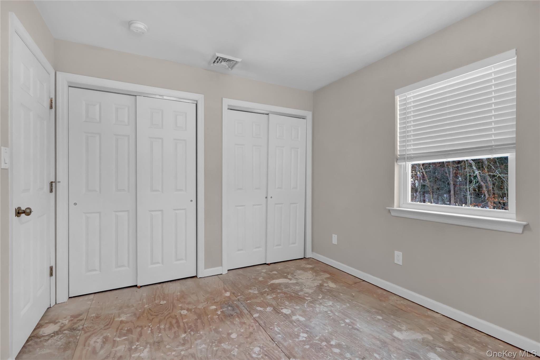 2 7th Street Center Moriches, NY 11934 - Photo 19 of 28 a view of an empty room with window and closet area