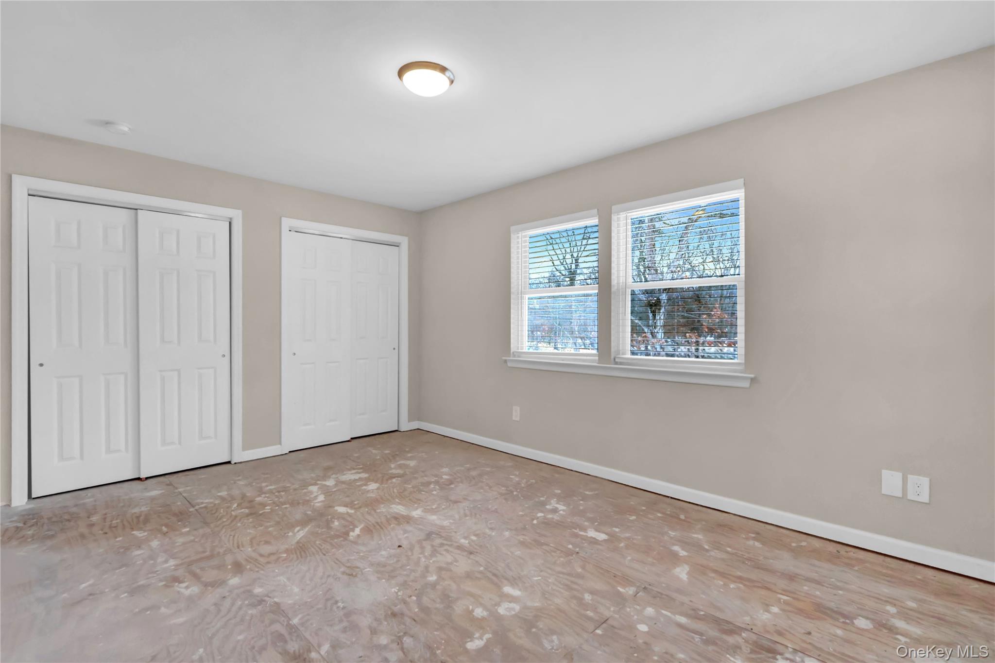 2 7th Street Center Moriches, NY 11934 - Photo 22 of 28 an empty room with windows