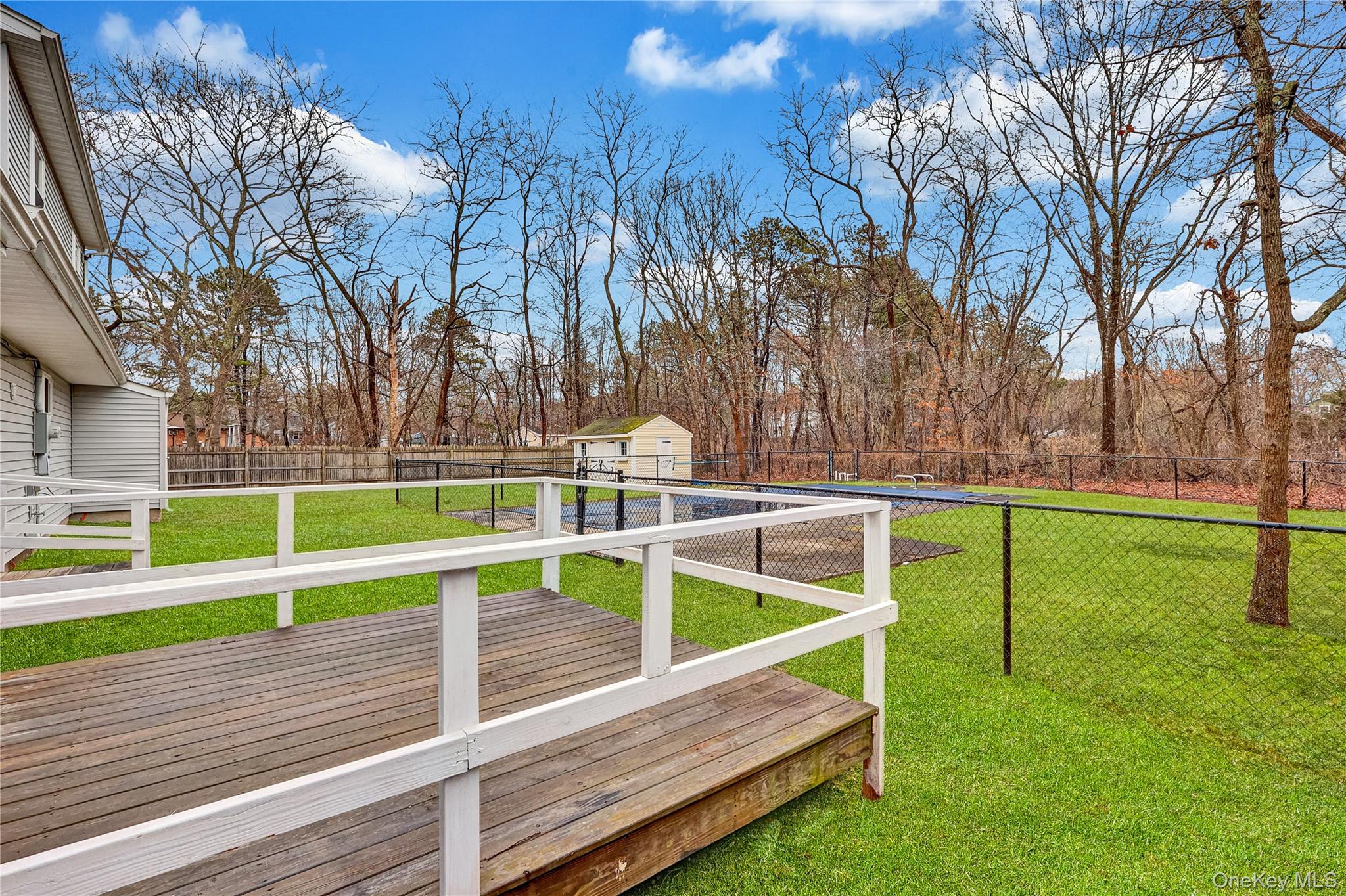 2 7th Street Center Moriches, NY 11934 - Photo 24 of 28 a view of backyard with wooden fence