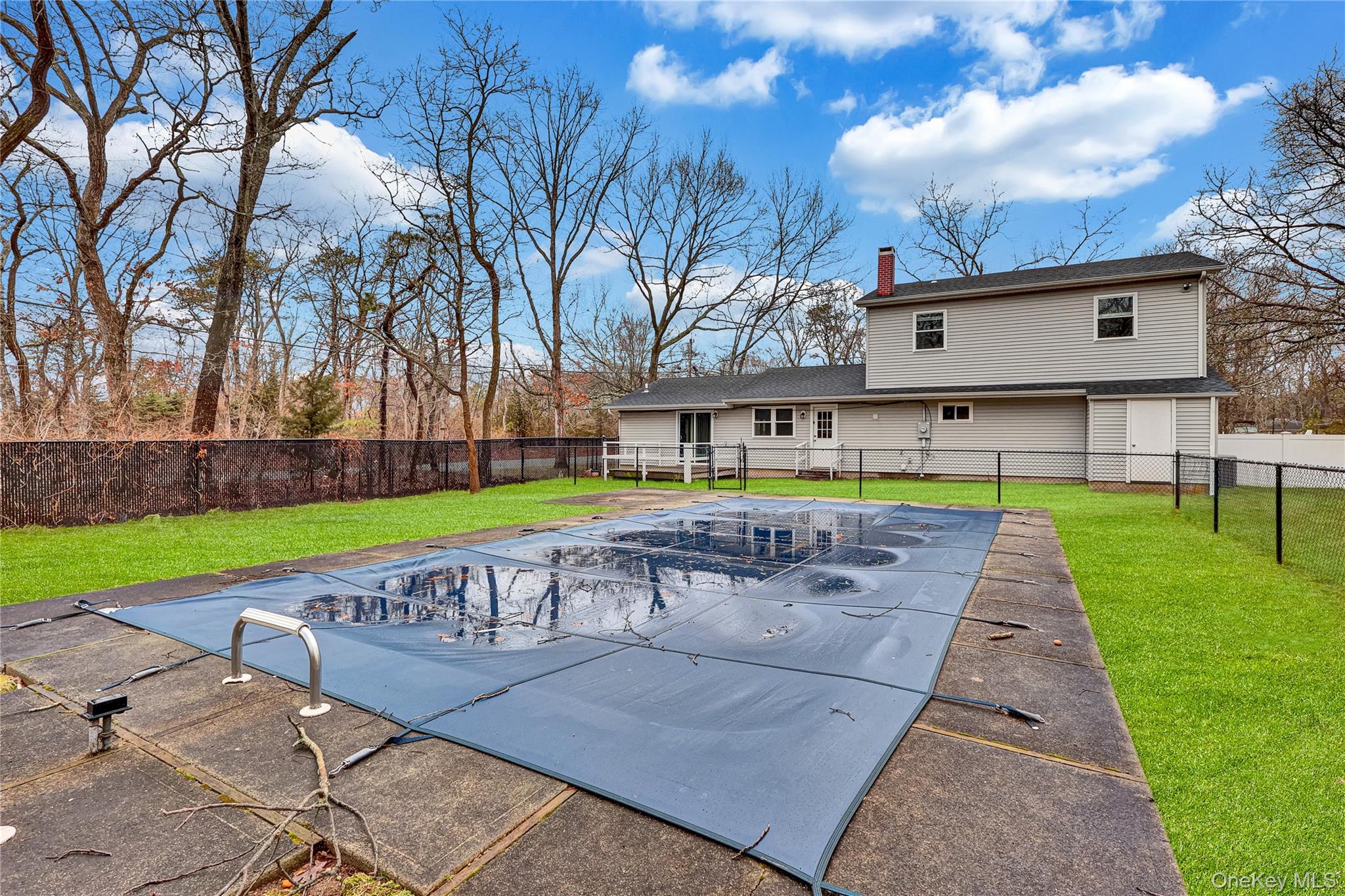 2 7th Street Center Moriches, NY 11934 - Photo 26 of 28 a view of yard with swimming pool and green space