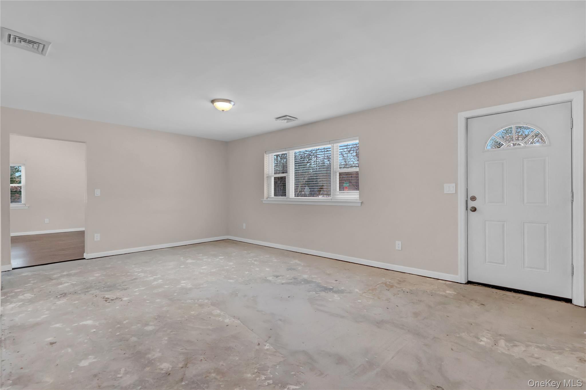 2 7th Street Center Moriches, NY 11934 - Photo 4 of 28 a view of an empty room with a window