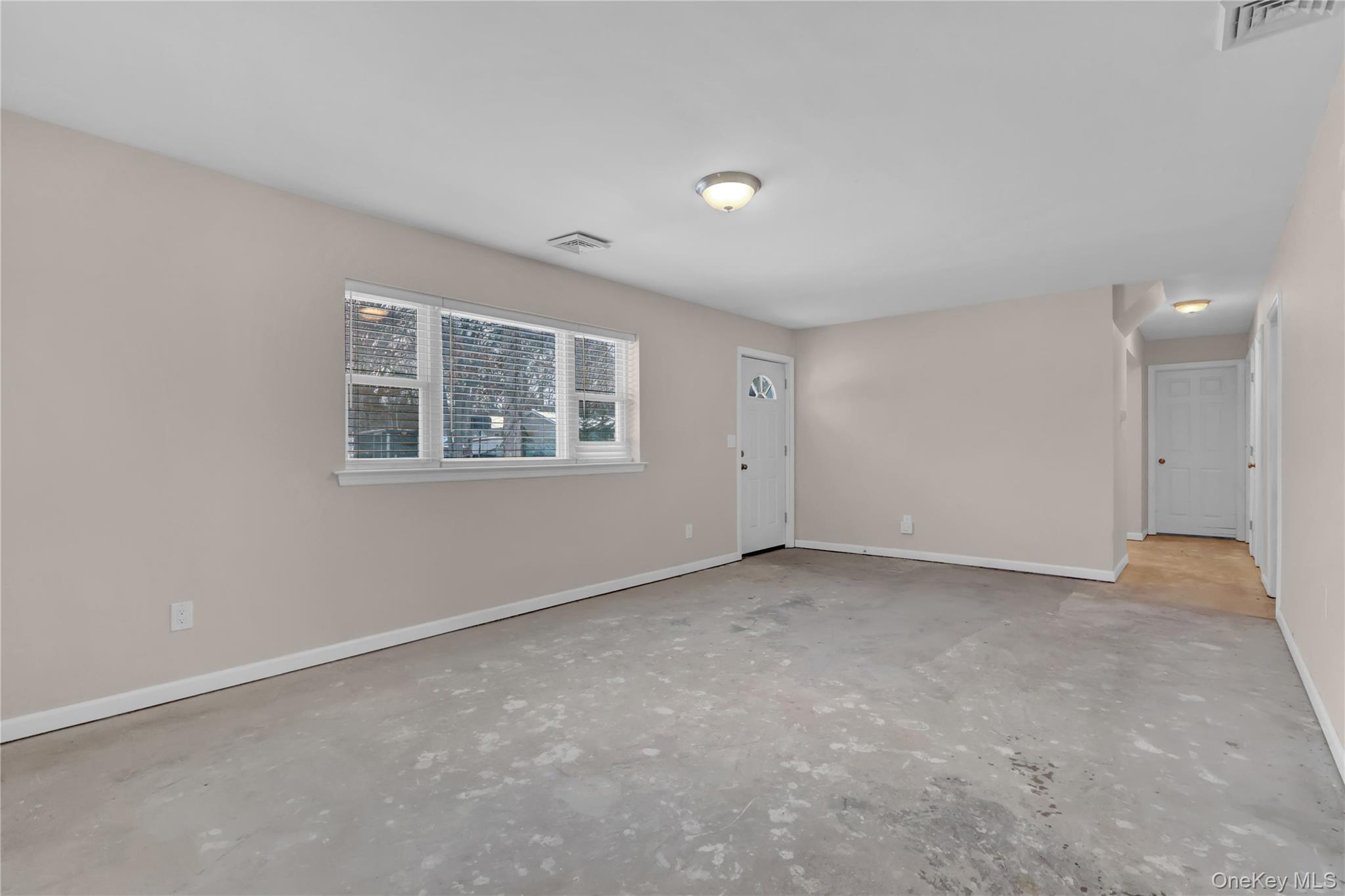 2 7th Street Center Moriches, NY 11934 - Photo 5 of 28 a view of an empty room with a window