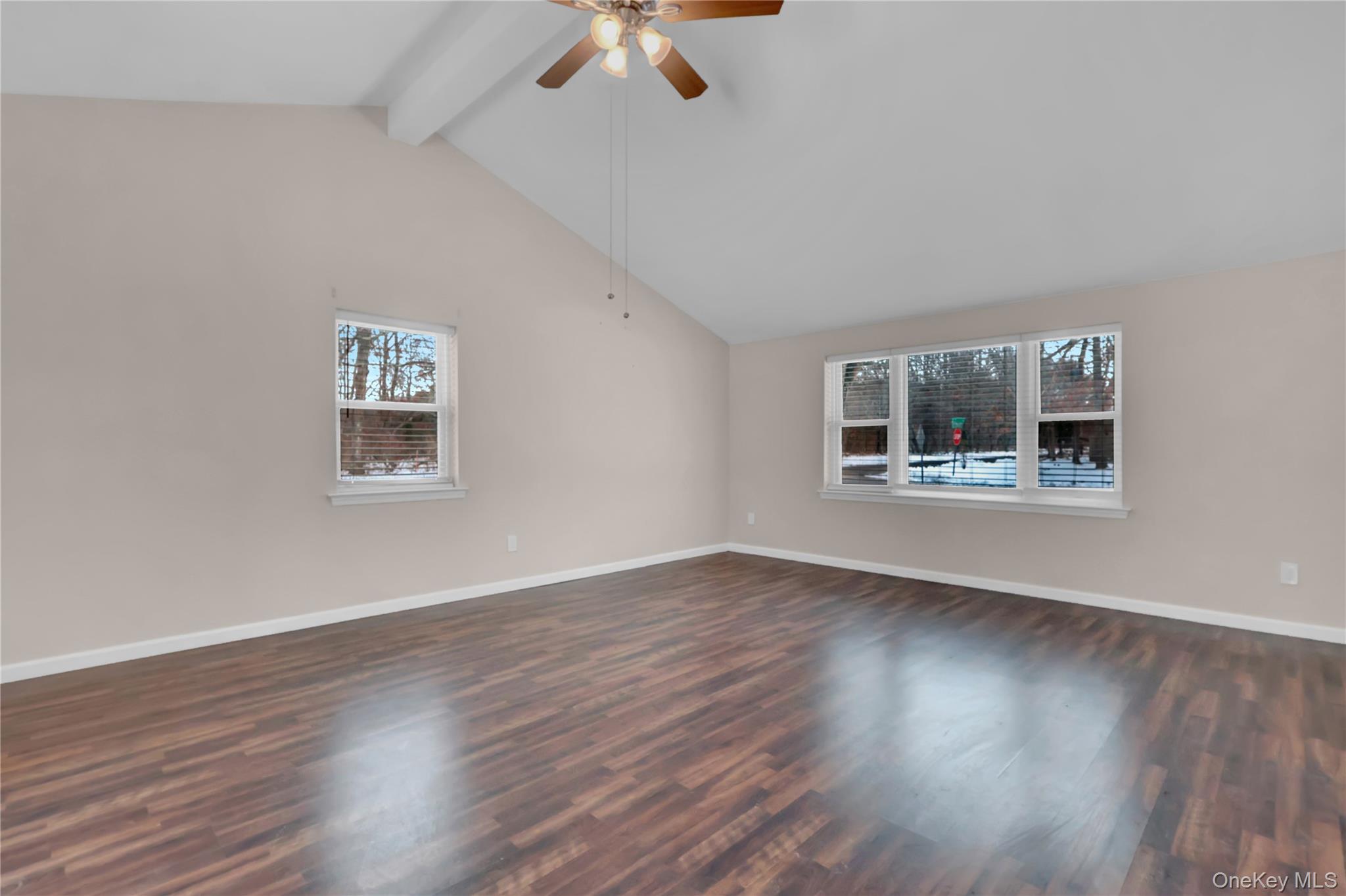 2 7th Street Center Moriches, NY 11934 - Photo 7 of 28 a view of an empty room with wooden floor and a window