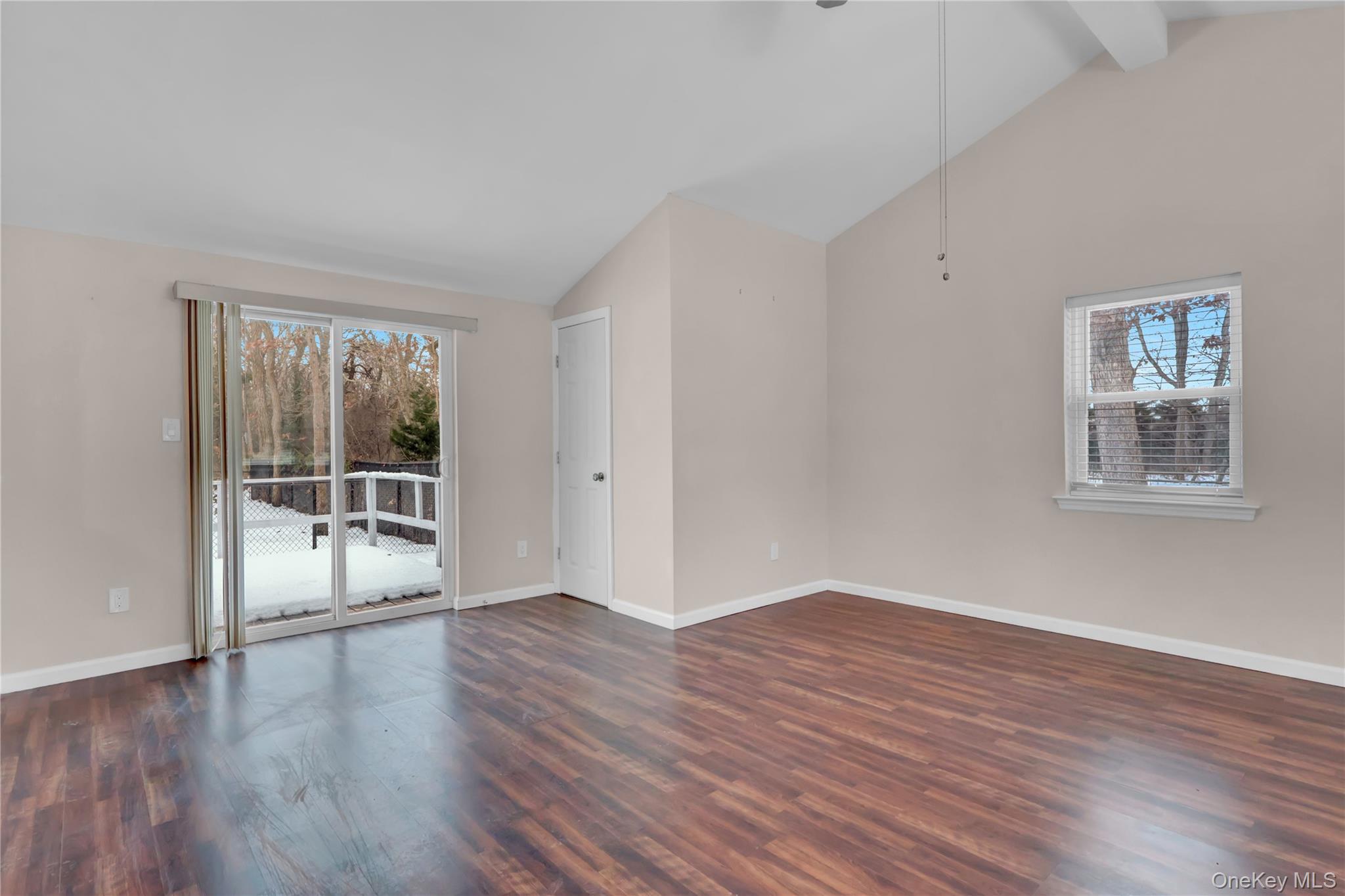 2 7th Street Center Moriches, NY 11934 - Photo 9 of 28 a view of an empty room with wooden floor and a window