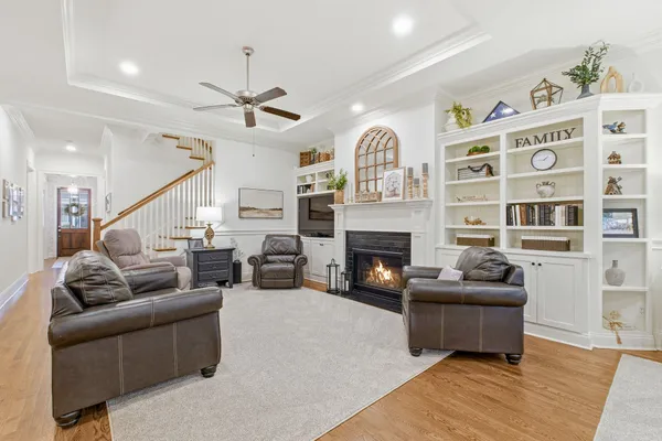 a view of kitchen with sink and refrigerator