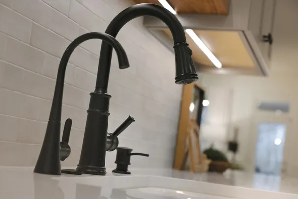 a living room with furniture ceiling fan and a large window