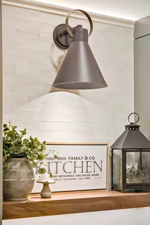 a living room with furniture kitchen view and a chandelier