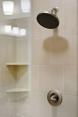 a living room with furniture ceiling fan and a large window