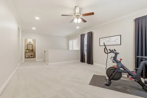 a dining room with furniture a rug and a large window