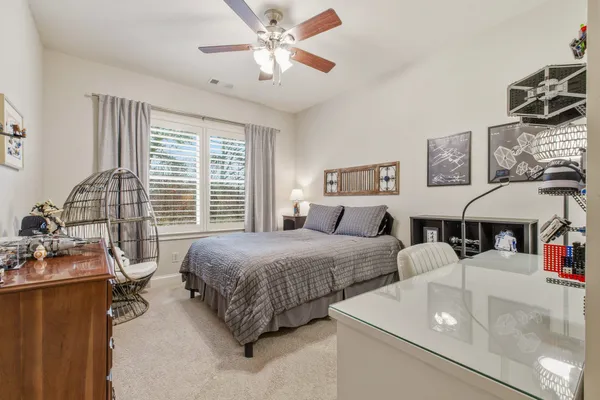 a living room with furniture and white wall