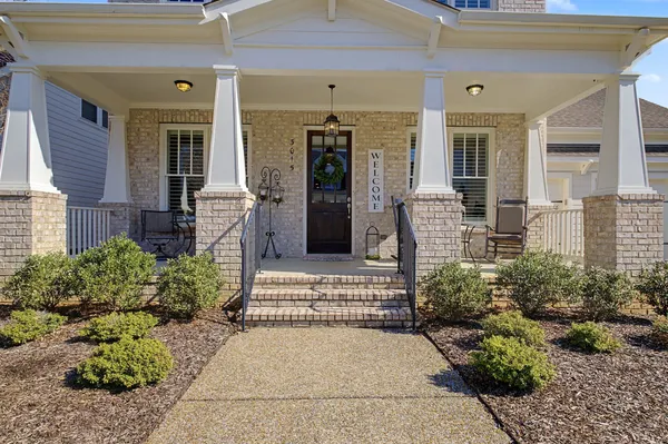 a front view of a house with a porch