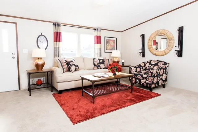 a bathroom with a granite countertop sink a mirror and shower