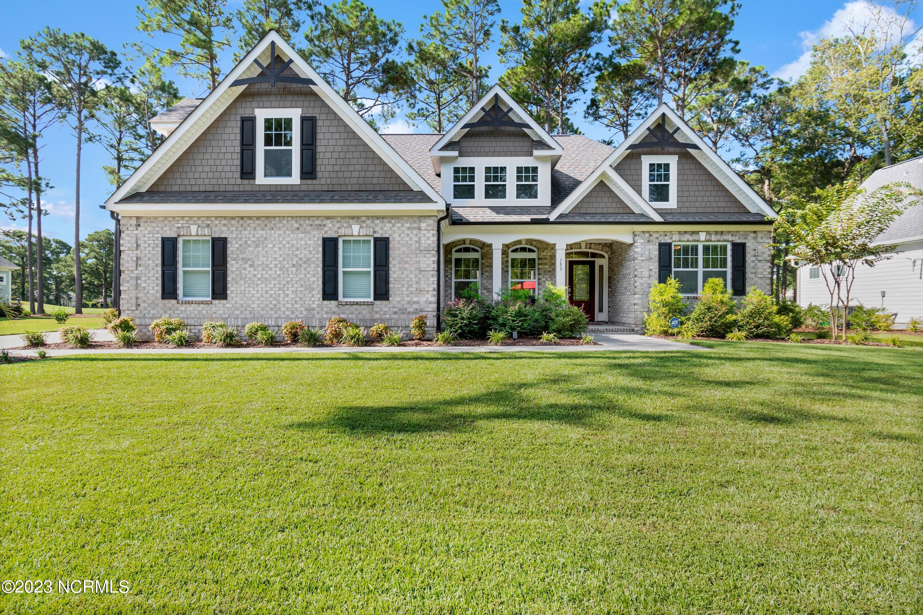 153 Clubhouse Road Sunset Beach, NC 28468 - Photo 2 of 65 Front of home