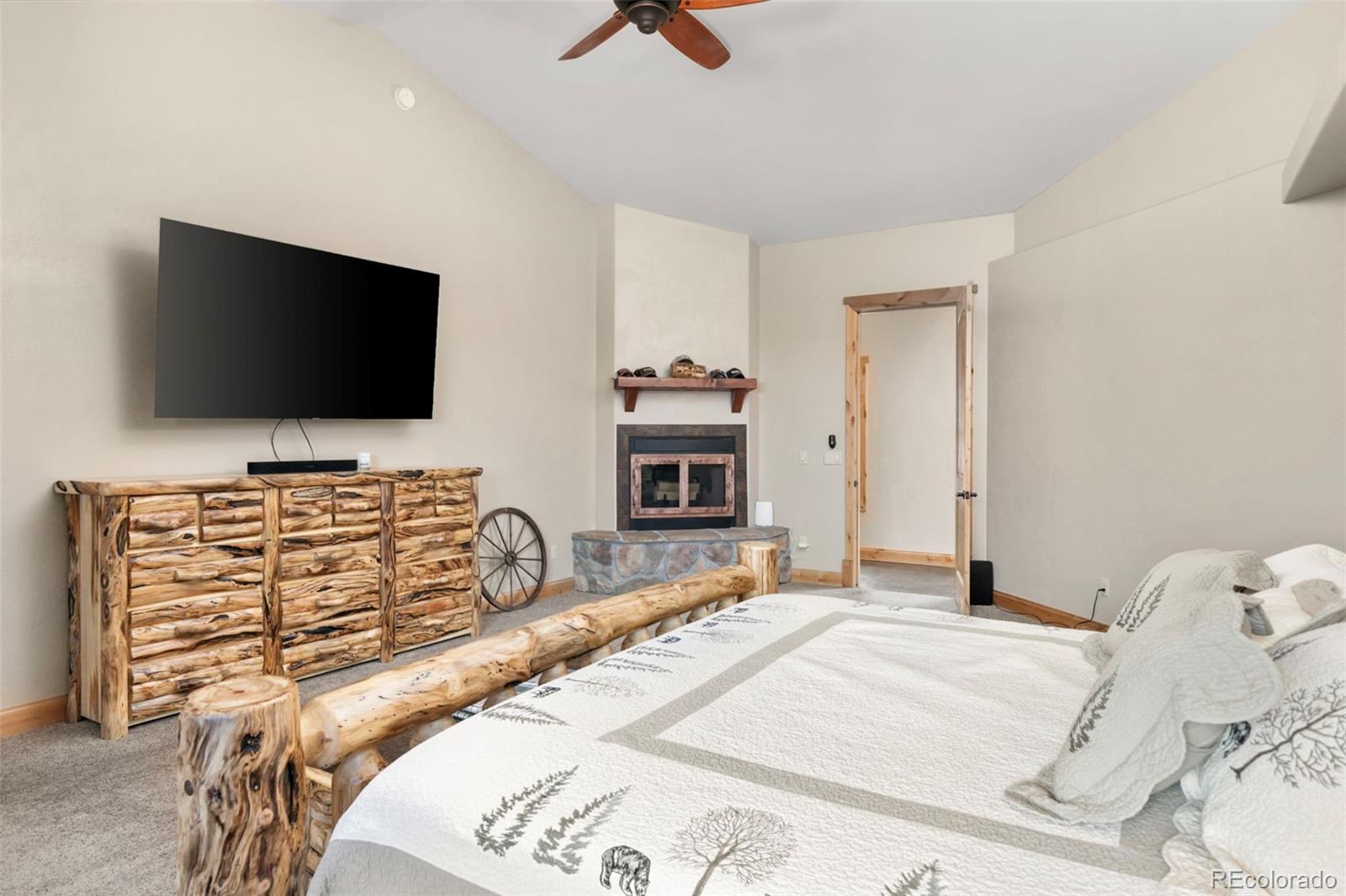 252 Running Elk Point Divide, CO 80814 - Photo 12 of 50 a bedroom with a bed and a flat screen tv