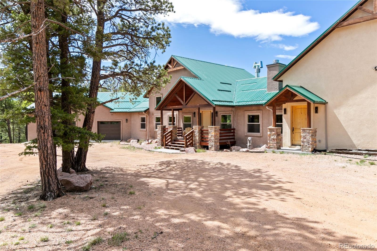 252 Running Elk Point Divide, CO 80814 - Photo 15 of 50 a front view of a house with a yard covered in snow