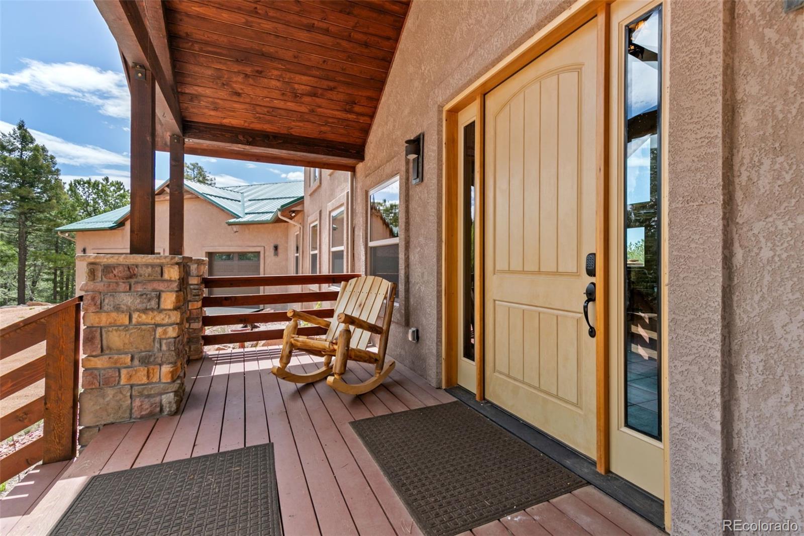 252 Running Elk Point Divide, CO 80814 - Photo 18 of 50 a view of balcony with wooden floor and outdoor seating