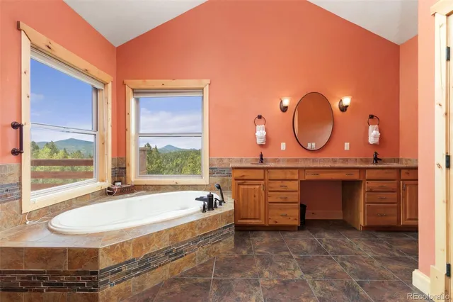 a room with wooden table and windows