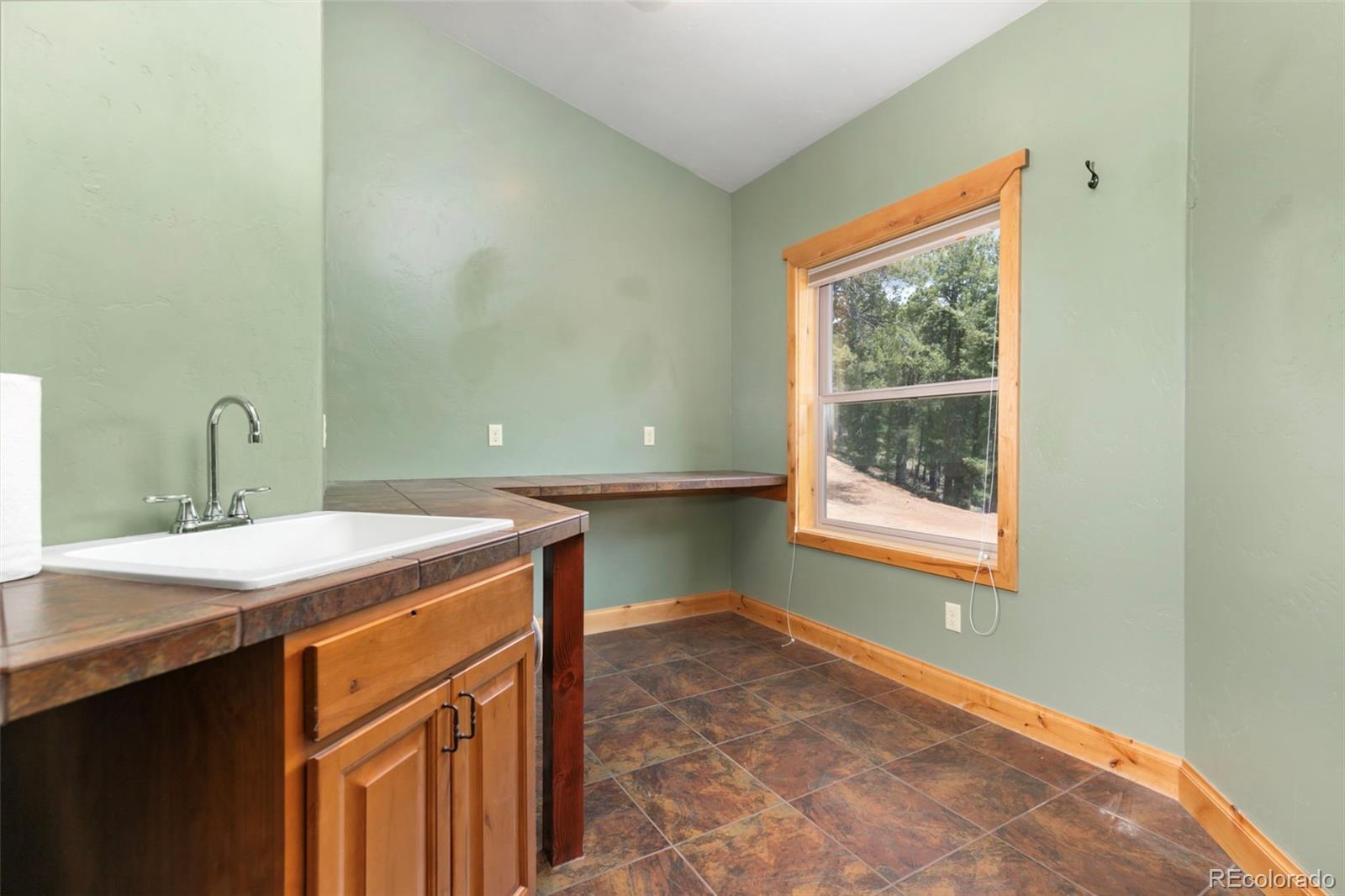 252 Running Elk Point Divide, CO 80814 - Photo 29 of 50 a room with a sink and a window