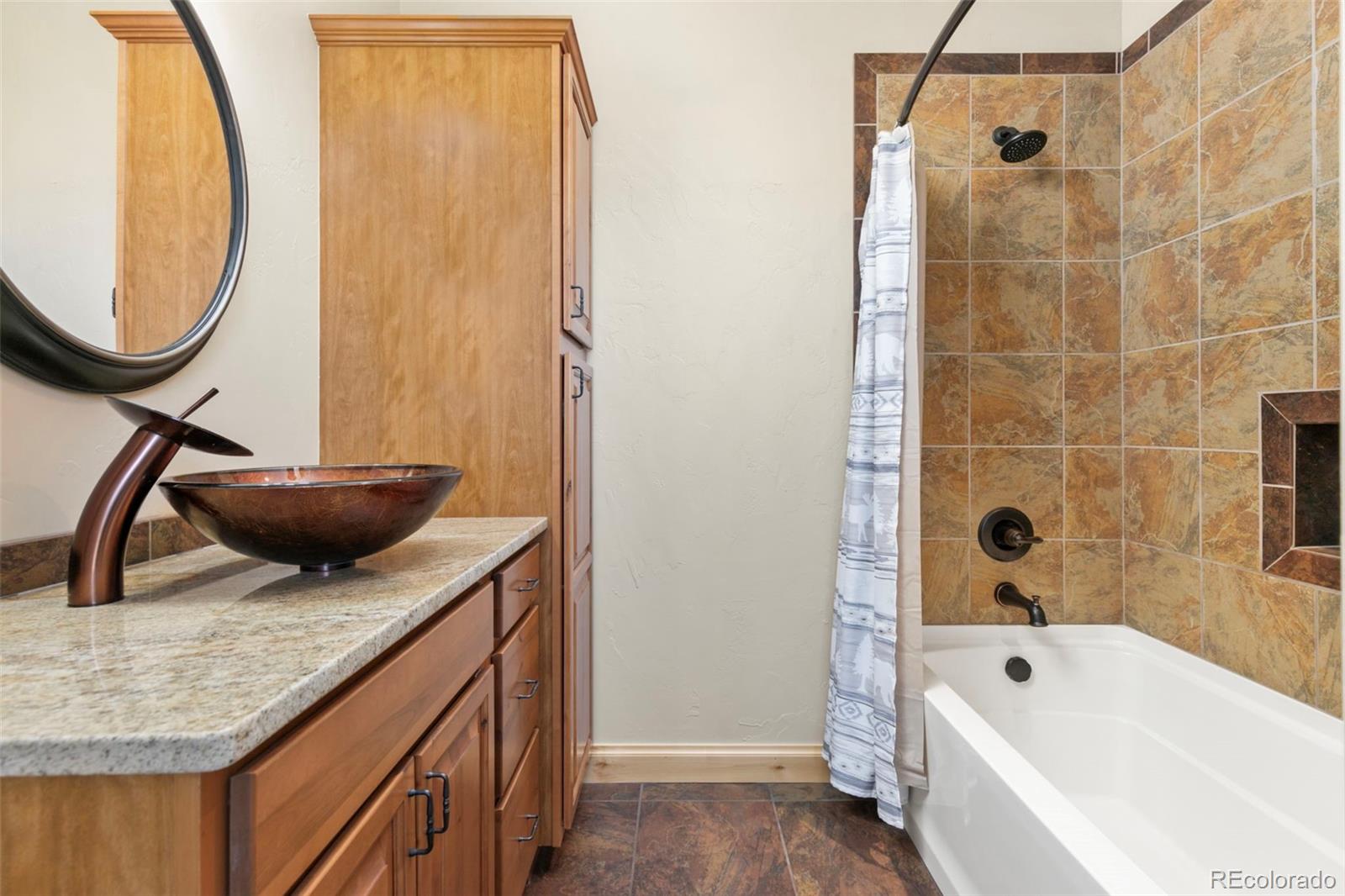 252 Running Elk Point Divide, CO 80814 - Photo 44 of 50 a bathroom with a granite countertop sink a toilet and bathtub