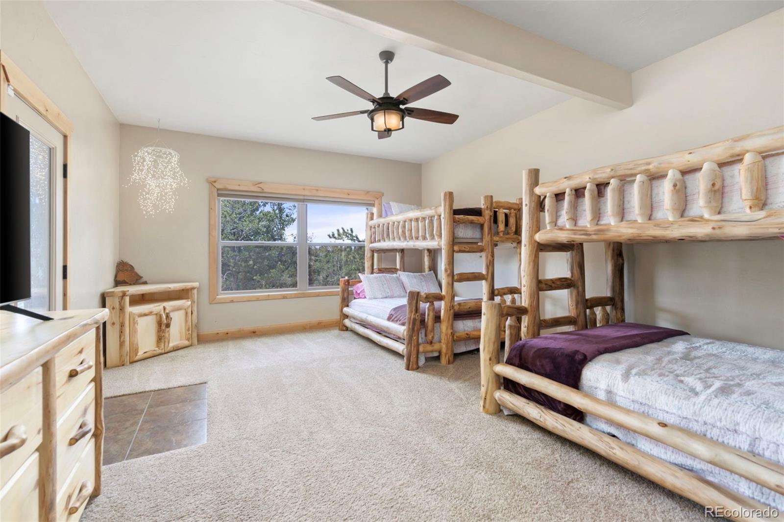 252 Running Elk Point Divide, CO 80814 - Photo 45 of 50 a bedroom with furniture and a large window